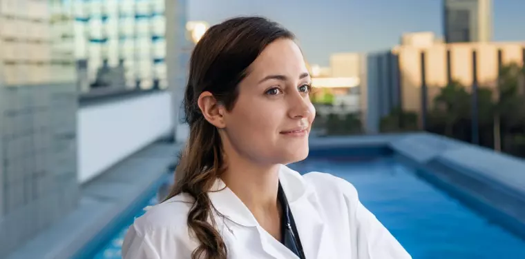 Nurse posing at TENTEN Rooftop pool